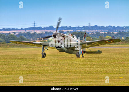 The AMCF's 1941 EFW/Dornier D-3801 HB-RCF taxying in across the grass at Duxford in 2011. It is painted as Morane Saunier MS.406C-1 No138 of the Frenc Stock Photo