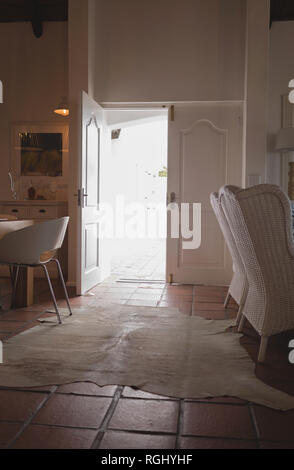 Entrance door opened in living room at home Stock Photo