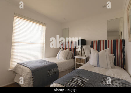 Luxury bedroom with blankets and pillows Stock Photo