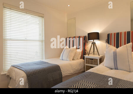 Luxury bedroom with blankets and pillows Stock Photo