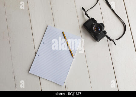 Notepad, pencil and camera Stock Photo