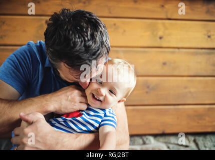 Father tickling happy baby girl Stock Photo