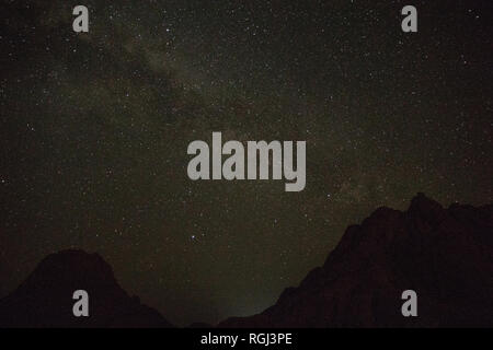 The milky way seen over the rocky mountains of Spitzkoppe in Namibia Stock Photo