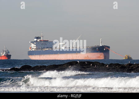 Oil tanker in offshore discharging maneuvers Stock Photo