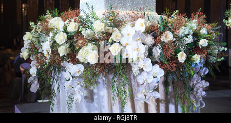 Beautiful Floral Arranging Stage with Fresh Natural Flowers Decorated in Wedding Reception. Wedding Ceremony Decoration, Celebration, Organizing Brida Stock Photo