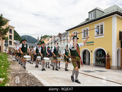 Festival with parade of fanfare and people in traditonal costumes Stock Photo