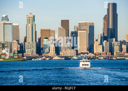 The Seattle Water Taxi and Downtown Seattle buildings and waterfront on Elliott Bay, Seattle, WA USA Stock Photo