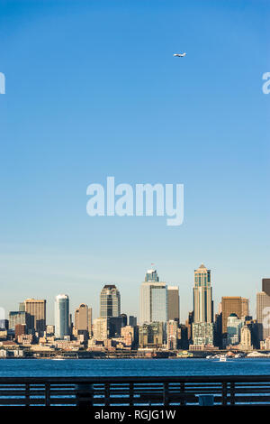 Downtown Seattle buildings and waterfront on Elliott Bay, Seattle, WA USA as seen from West Seattle. Stock Photo