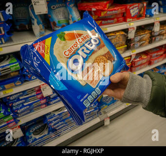 A hungry shopper chooses a package of Mondelez International's Nabisco brand Carrot Cake flavored Oreo Cookies, from the myriad varieties available, from a supermarket shelf in New York on Monday, January 28, 2019.  (Â© Richard B. Levine) Stock Photo