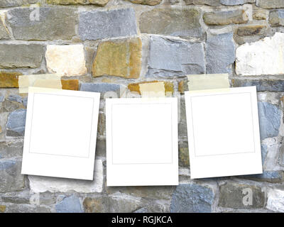 Three blank instant square photo frames on multicolored stone wall background Stock Photo