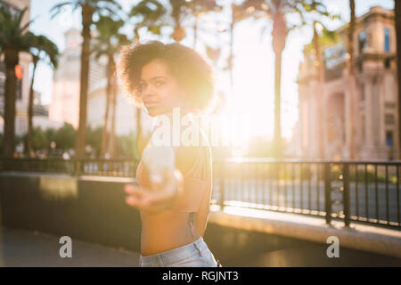USA, Nevada, Las Vegas, portrait of young woman in the city in backlight Stock Photo