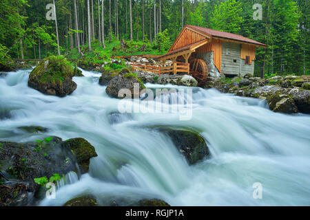 Old Mill at the river Schwarzbach near the famous Golling waterfall in spring, Austria Stock Photo
