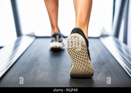 Person running on a treadmill Stock Photo