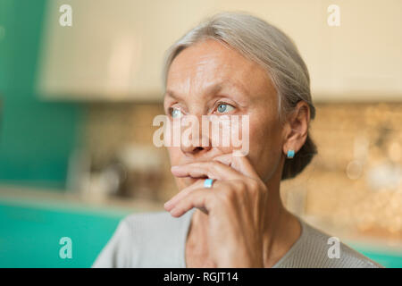 Portrait of pensive senior woman Stock Photo