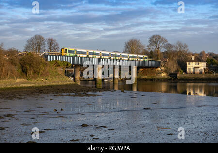 Southern Railway train crossing bridge over the River Itchen in St Denys, Southampton, Hampshire, England, UK Stock Photo