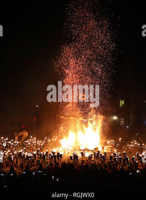 The Galley is set on fire on Shetland Isles during the Up Helly Aa Viking festival. Originating in the 1880s, the festival celebrates Shetland's Norse heritage. Stock Photo