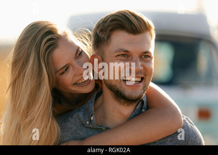 Happy affectionate young couple at camper van in rural landscape Stock ...