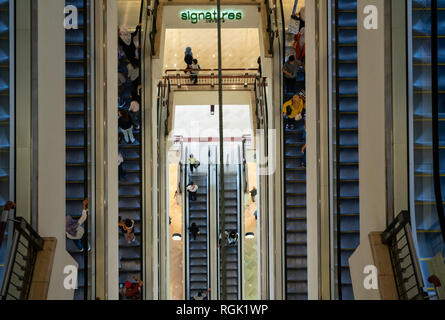 view of the escalators inside the Suria KLCC mall in Kuala Lumpur, Malaysia Stock Photo