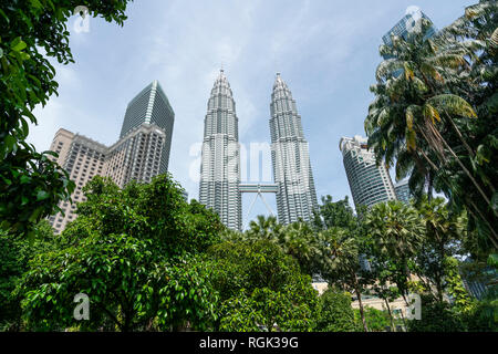 A view of KLCC park with the Petronas Towers in the background in Kuala Lumpur, Malaysia Stock Photo