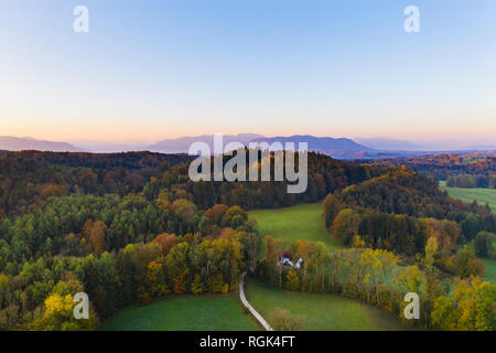Germany, Upper Bavaria, Toelzer Land, Bavarian Prealps, Dietramszell, Zeller Wald, Aerial view of forest in autumn at sunrise