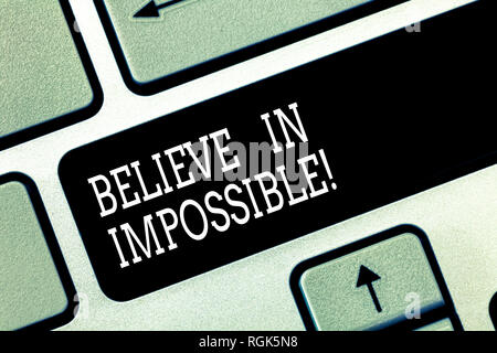 Writing note showing Believe In Impossible. Business photo showcasing Never give up hope that something amazing will happen Keyboard key Intention to  Stock Photo