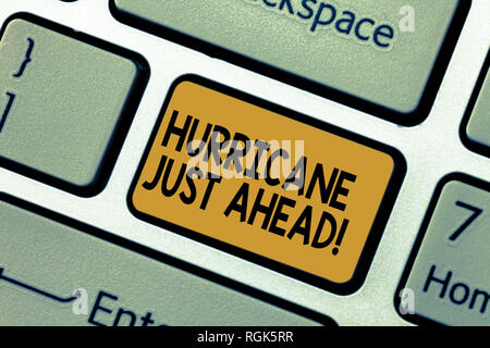 Word writing text Hurricane Just Ahead. Business concept for violent tropical cyclone is approaching to hit the land Keyboard key Intention to create  Stock Photo