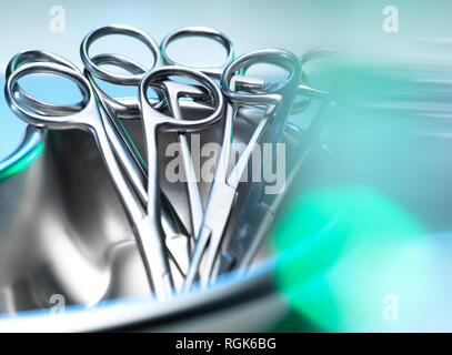 Surgical instruments, surgical scissors in a kidney shaped dish Stock Photo