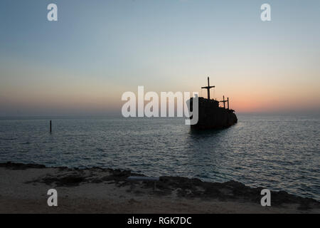 The greek ship wreckage in kish island at sunset time Stock Photo