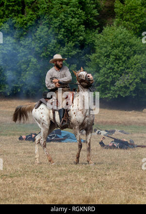 Duncan Mills, CA - July 14, 2018: Confederate soldier and horse at a Civil war reenactment. The Civil War Days is one of the largest reenactment event Stock Photo