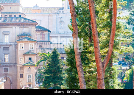 Vatican, Rome, Italy - November 16, 2018: Triangle classic roofs covering the facades of the medieval architecture buildings of Vatican museums comple Stock Photo