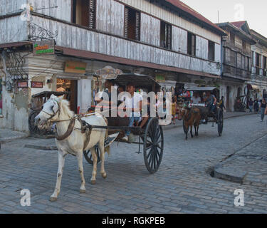 Kalesa horse carriages on historic Calle Crisologo, Vigan, Ilocos Sur, Philippines Stock Photo