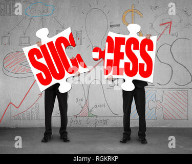 Connecting two puzzles for success with doodles Stock Photo