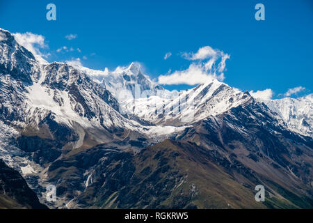 Panoramic view from Ice Lake area, the snow covered summit of Kangsar Kang in the distance Stock Photo