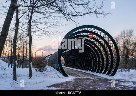 Entrance of pedestrian Pushkinskiy Bridge in winter in Gorky park in Moscow. Stock Photo