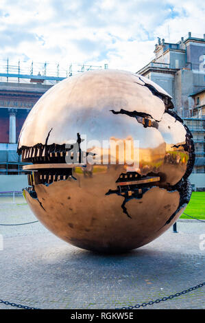 Vatican, Rome, Italy - November 16, 2018: Sphere Within Sphere Sfera con sfera is a bronze sculpture by Italian sculptor Arnaldo Pomodoro decorates a  Stock Photo