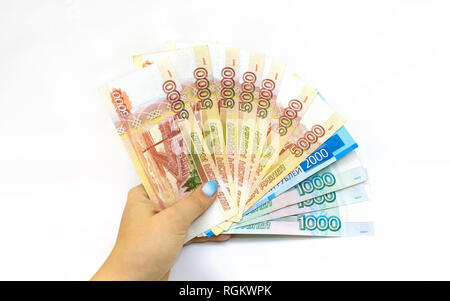 Woman hand holds paper money. Russian rouble banknote cash. Isolated on white Stock Photo