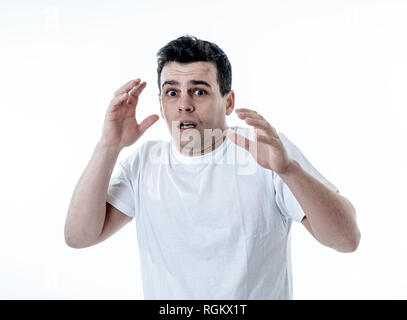 Portrait of young man in shock with a scared face expression making frightened gestures in People, human emotions, feelings and horror facial expressi Stock Photo