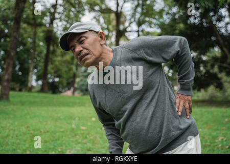 asian senior old man having back pain Stock Photo