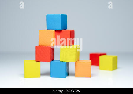 Building from wooden colourful childrens blocks Stock Photo