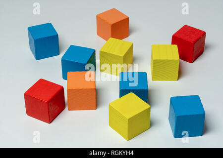 Colorful wooden childen's building blocks scattered loose Stock Photo