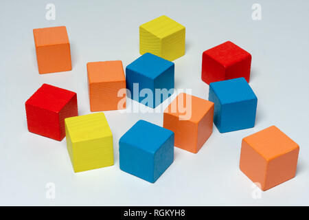 Colorful wooden childen's building blocks scattered loose Stock Photo