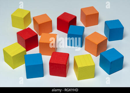Colorful wooden childen's building blocks scattered loose Stock Photo