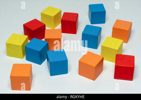 Colorful wooden childen's building blocks scattered loose Stock Photo