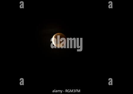 Red moon during an eclipse phase Stock Photo