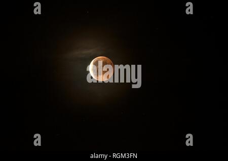 Red moon during an eclipse phase Stock Photo