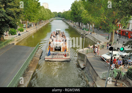 Passenger Cruiser on Canal Cruise Passes Through a Lock on Canal Saint-Martin Paris Stock Photo