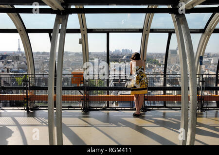 Tourist Enjoying a Panoramic View over the Paris Skyline from Centre Georges Pompidou or Beaubourg Modern Art Museum Paris France