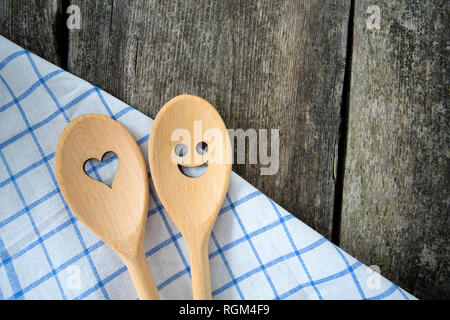 wooden spoons on kitchen table Stock Photo