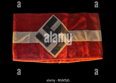 Nazi symbol flag arm band on black background Stock Photo