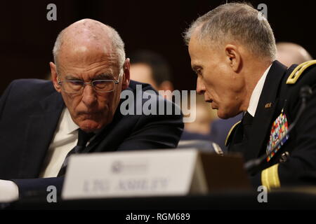 Washington, District of Columbia, USA. 29th Jan, 2019. Director Daniel Coats, Office of the Director of National Intelligence (ODNI) and Director General Robert Ashley, Defense Intelligence Agency (DIA) confer as they testify before the United States Senate Select Committee on Intelligence during an open hearing on ''Worldwide Threats'' on Capitol Hill in Washington, DC on Tuesday, January 29, 2019 Credit: Martin H. Simon/CNP/ZUMA Wire/Alamy Live News Stock Photo